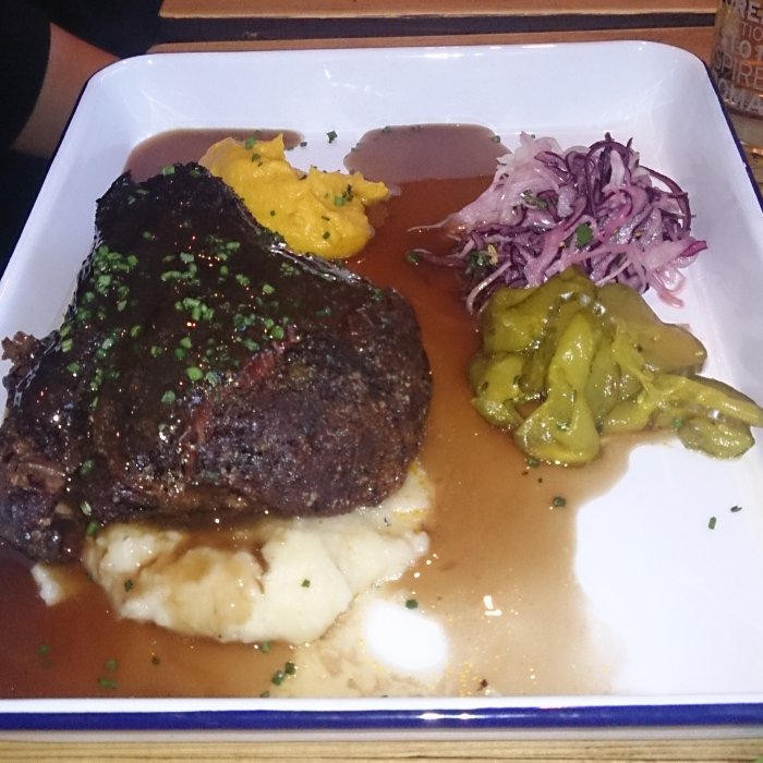 Ox cheek on mash with gravy and pickles